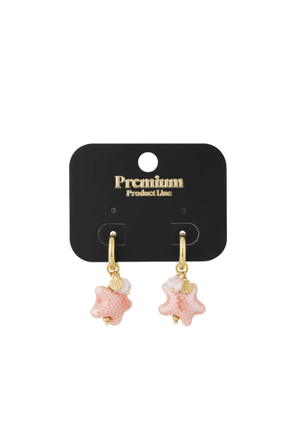 Pink starfish charm hoop earrings displayed on black premium product card