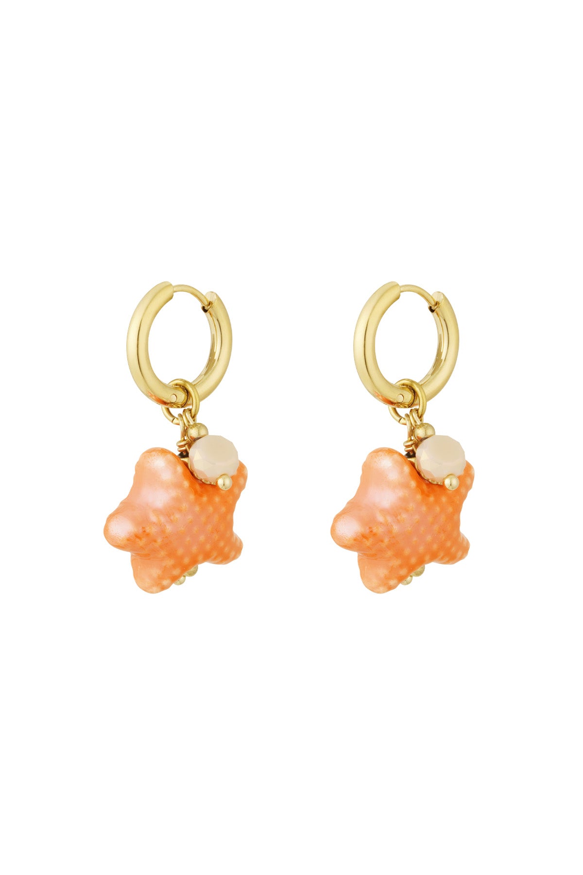 Close-up of bright orange starfish charm hoop earrings with gold-tone hoops and bead accents