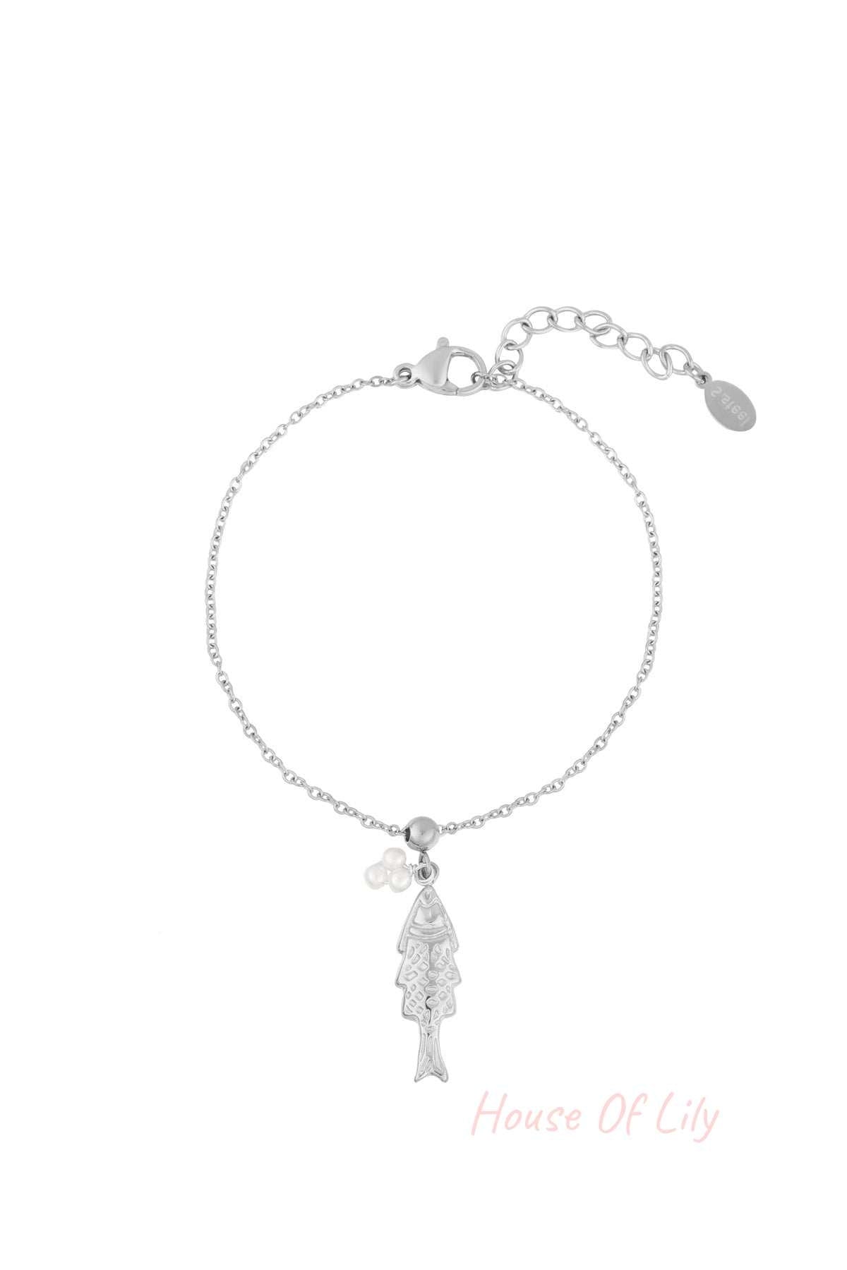 Silver tone delicate charm bracelet featuring a fish pendant and faux pearl cluster on a fine chain with lobster clasp