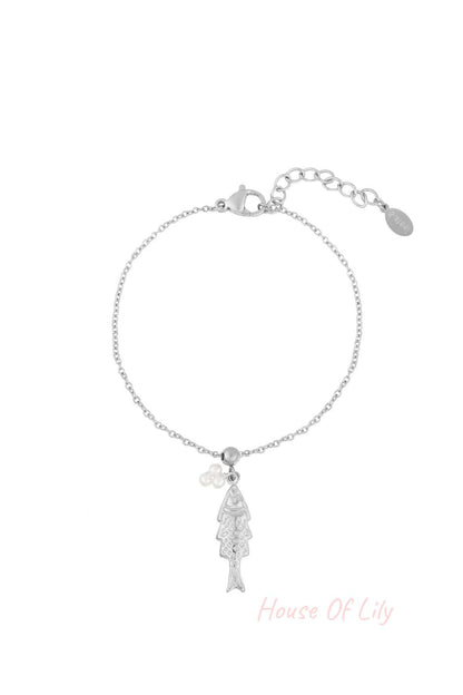 Silver tone delicate charm bracelet featuring a fish pendant and faux pearl cluster on a fine chain with lobster clasp