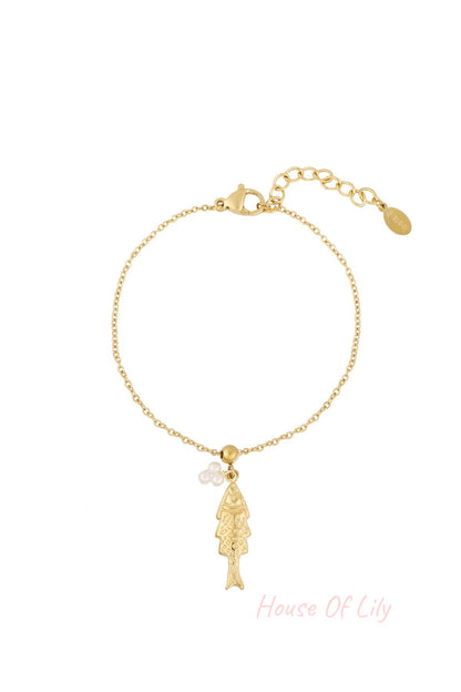 Gold tone fish pendant charm bracelet with faux pearl cluster on a fine chain with lobster clasp