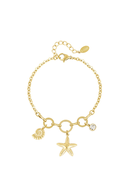 Gold-tone charm bracelet featuring starfish, shell, and rhinestone charms on linked chain