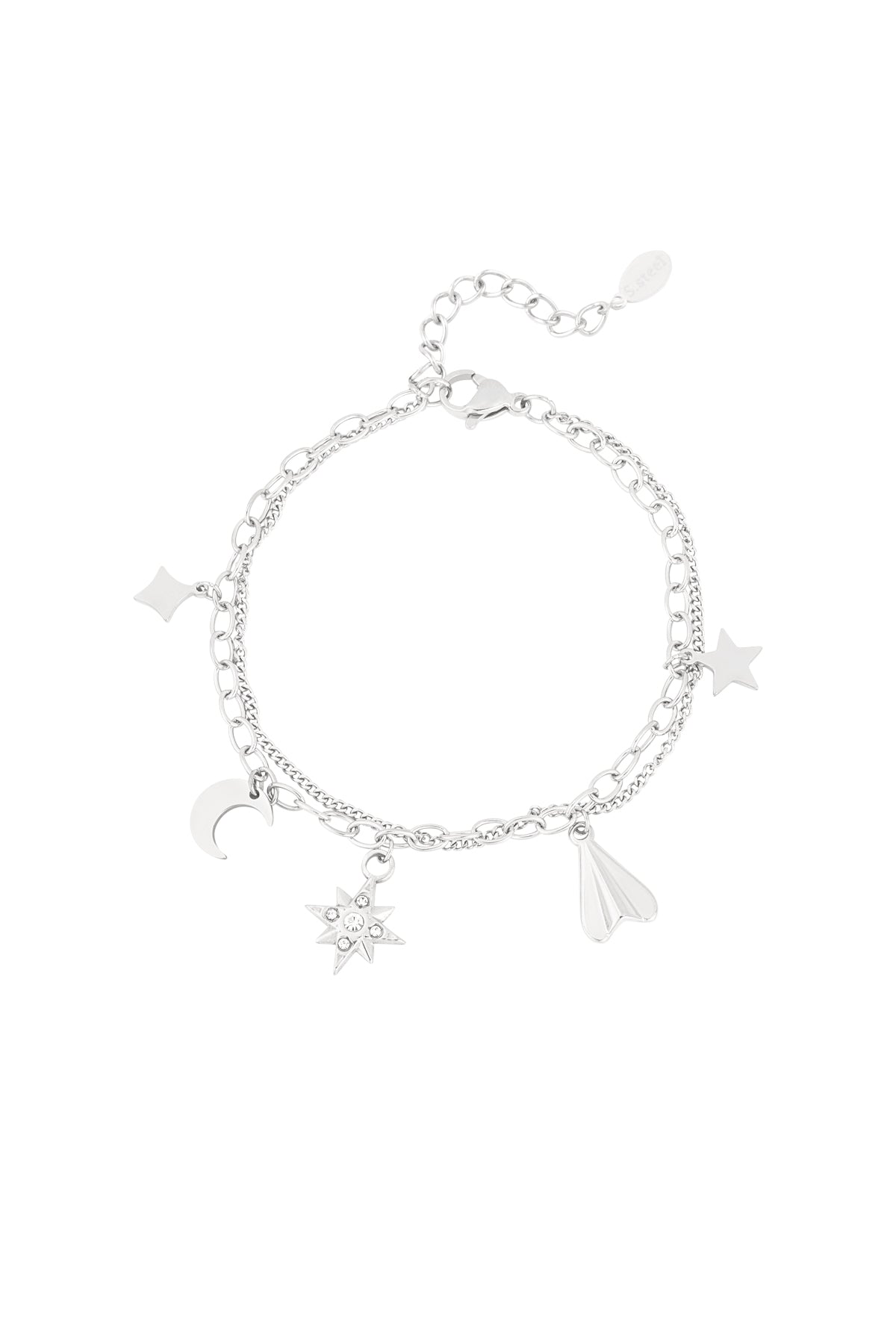 Silver-tone double chain charm bracelet with moon, star, gemstone starburst, diamond, and paper plane charms on white background