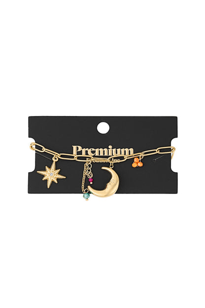 Gold charm bracelet displayed on black packaging card labelled 'Premium' with moon, star, heart and colourful bead charms