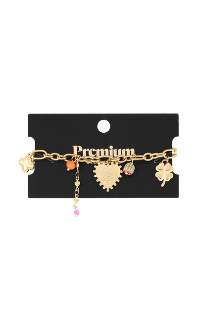 Gold charm bracelet displayed on a black card with 'Premium' text