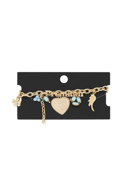 Golden charm bracelet displayed on a black branded card showcasing the linked chain and colorful charms against a white background