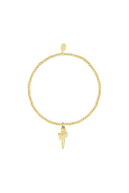 Close-up of a golden beaded bracelet featuring a small seashell charm on a white background