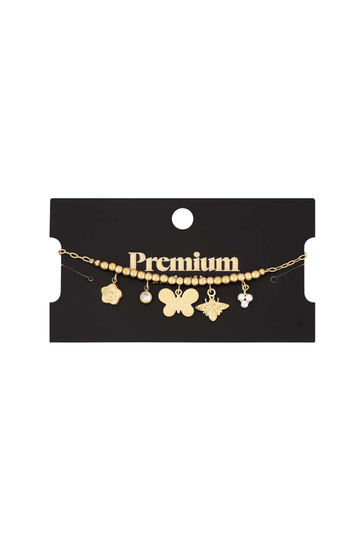 Gold-tone charm bracelet with butterfly, bee, flower, crystal, and pearl charms displayed on black Premium brand card