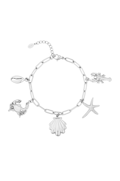Silver-tone seaside charm bracelet isolated on white background