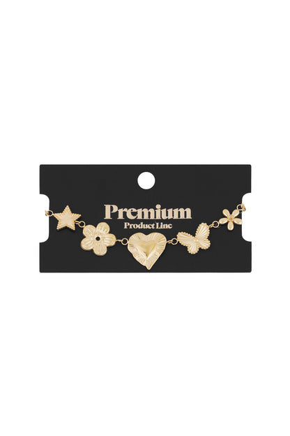 Gold charm bracelet displayed on a black card branded Premium Product Line