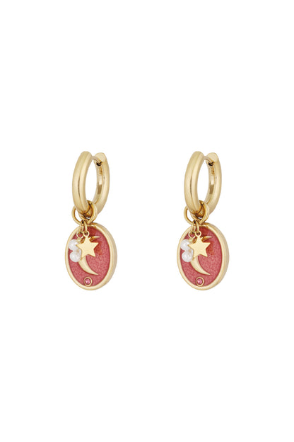 Pair of gold-tone hoop earrings with pink enamel oval charms featuring crescent moon, star, faux pearls and rhinestone details on white background