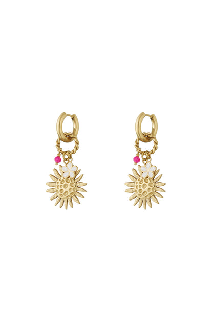 Pair of gold-tone drop earrings featuring textured sun charms, small white enamel flowers, and pink beads on hoop and twisted ring attachments.
