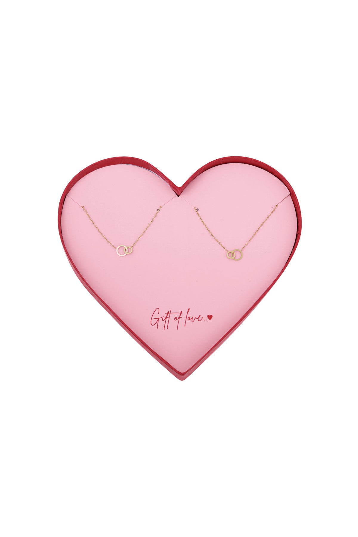 Heart-shaped pink box with two gold-tone infinity bracelets arranged inside and the message 'Gift of love' written in red