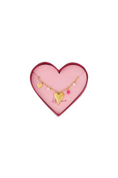 Gold heart charm bracelet with pearls and pink bead on gold bead chain in heart-shaped pink and red gift box