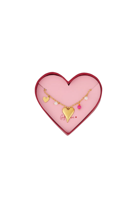 Gold heart charm bracelet with pearls and pink bead on gold bead chain in heart-shaped pink and red gift box