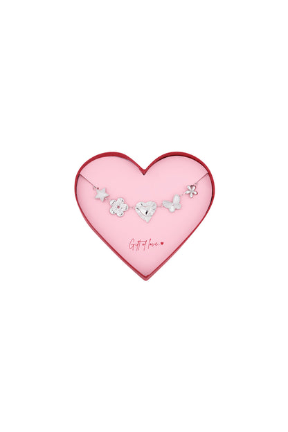 Silver stainless steel bracelet with star, flower, heart, butterfly, and flower charms in a pink heart-shaped box with red edge and 'Gift of love' text