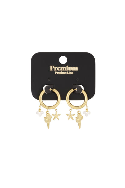 Gold charm hoop earrings displayed on black Premium Product Line card