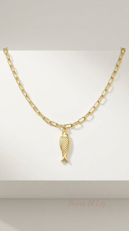 Gold chain necklace featuring a textured, polished fish pendant on a rectangular link chain.