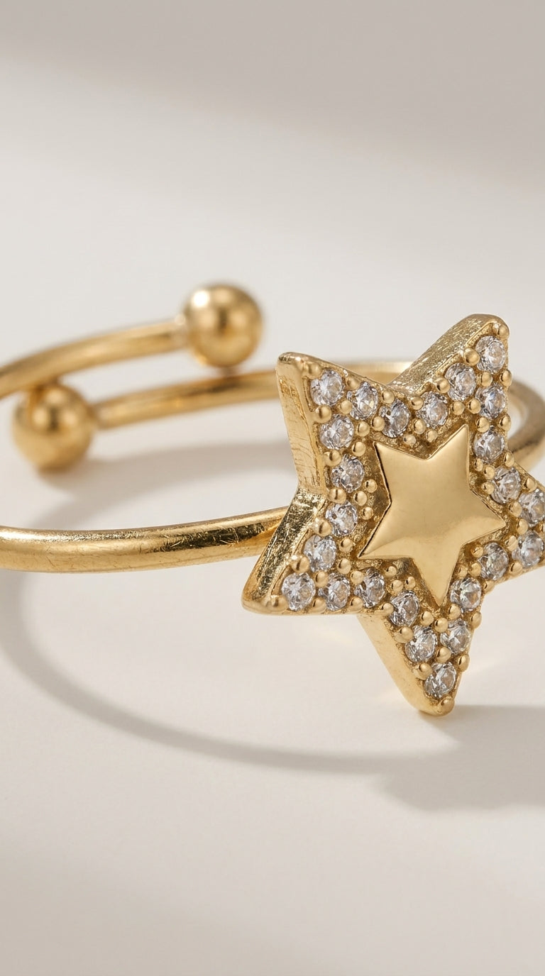 Gold-finish metal Celestial Star Statement Ring featuring a pave-set star with a central gold star shape.