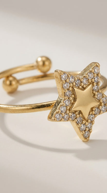 Gold-finish metal Celestial Star Statement Ring featuring a pave-set star with a central gold star shape.