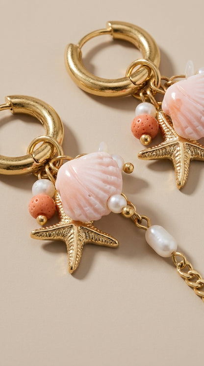 Oceanic Gold Drop Earrings featuring gold hoops, pink shell charms, starfish, and pearls.