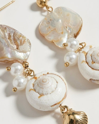 House of Lily gold drop earrings featuring iridescent mother-of-pearl, white shell, and pearl accents.