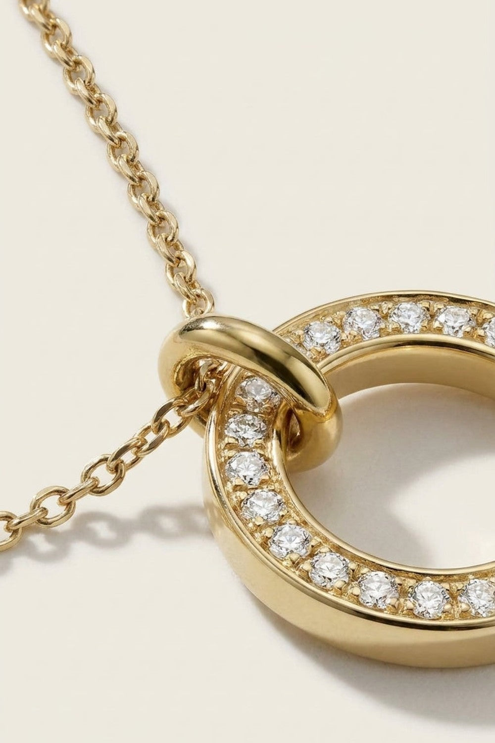 Dual Tone Circle necklace in yellow gold with pavé-set stones along the ring.