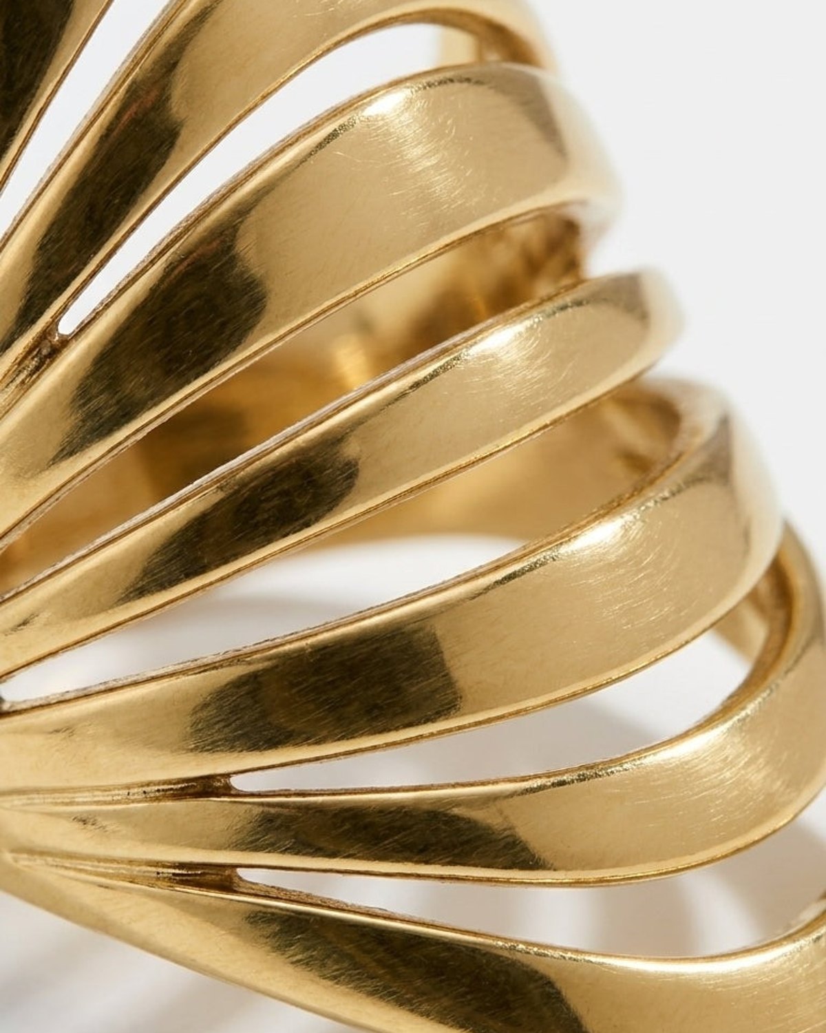 House Of Lily gold-tone statement ring with a multi-strand wave design.
