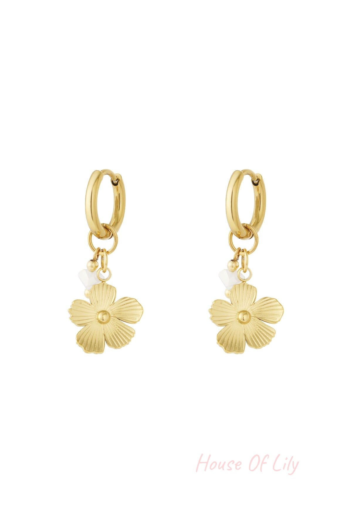 Pair of gold drop earrings featuring textured flower charms with small white bead accents on hoop backs displayed on white background