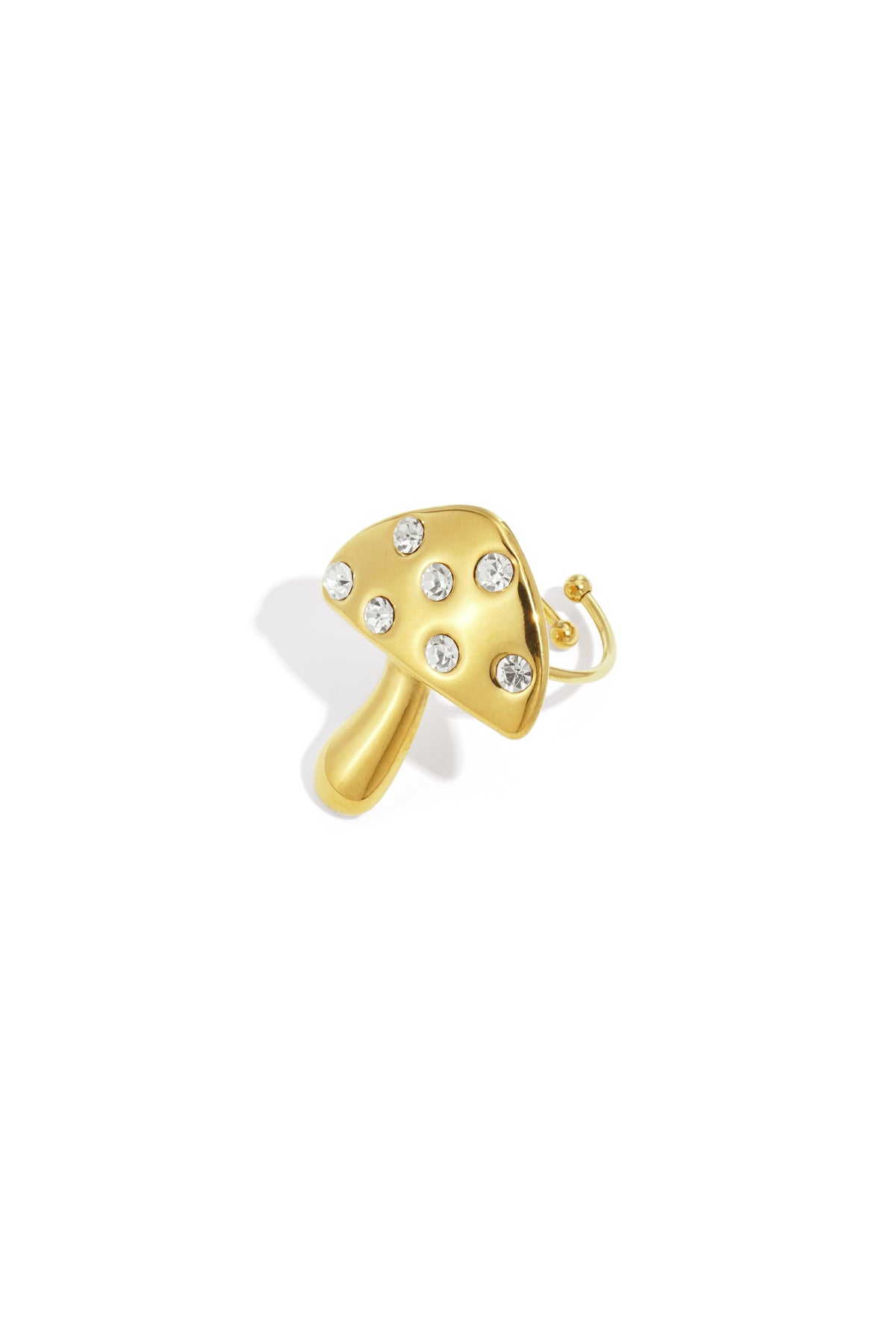 Gold mushroom-shaped statement ring with rhinestones on white background