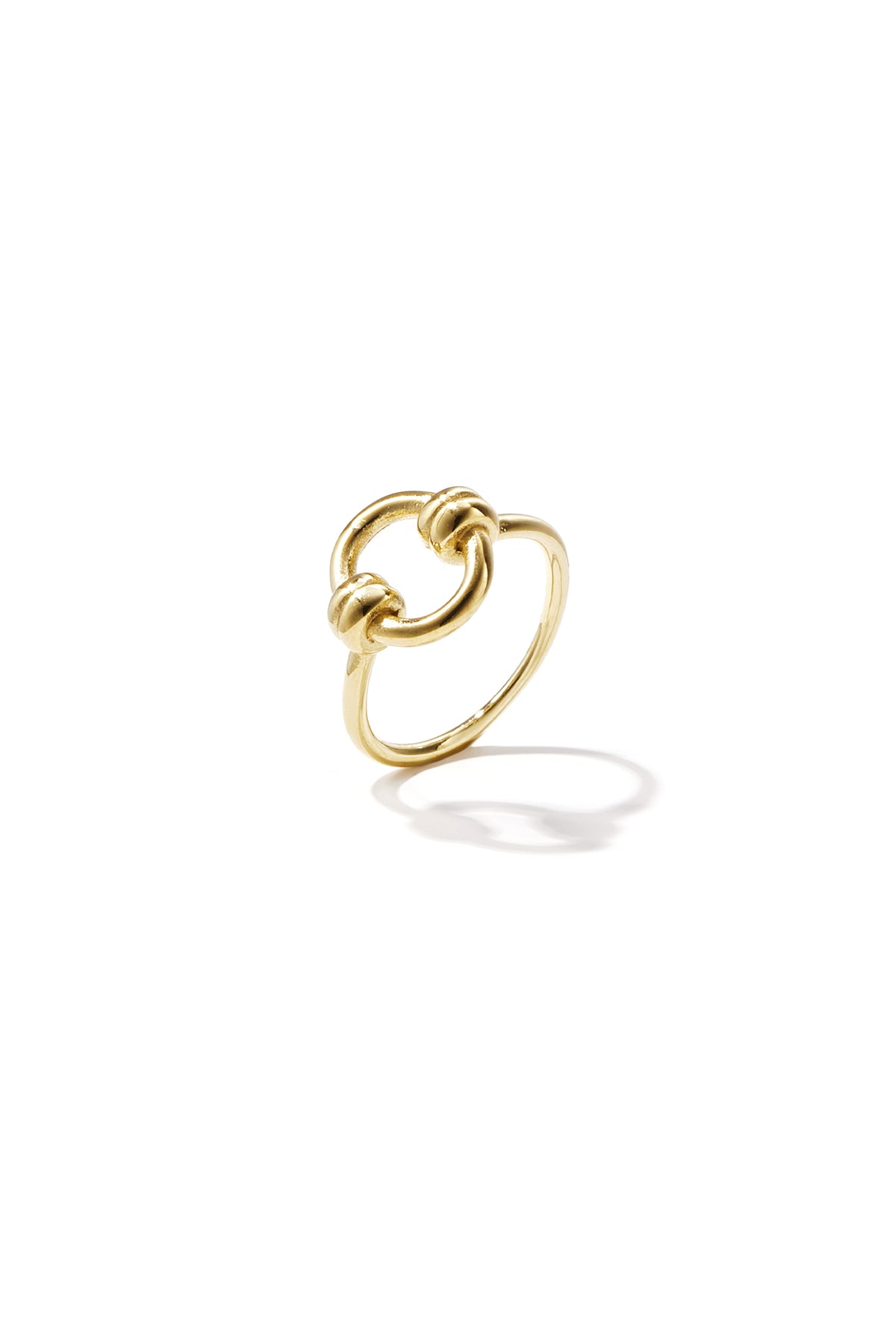 Gold circle knot ring with smooth polished finish on white background