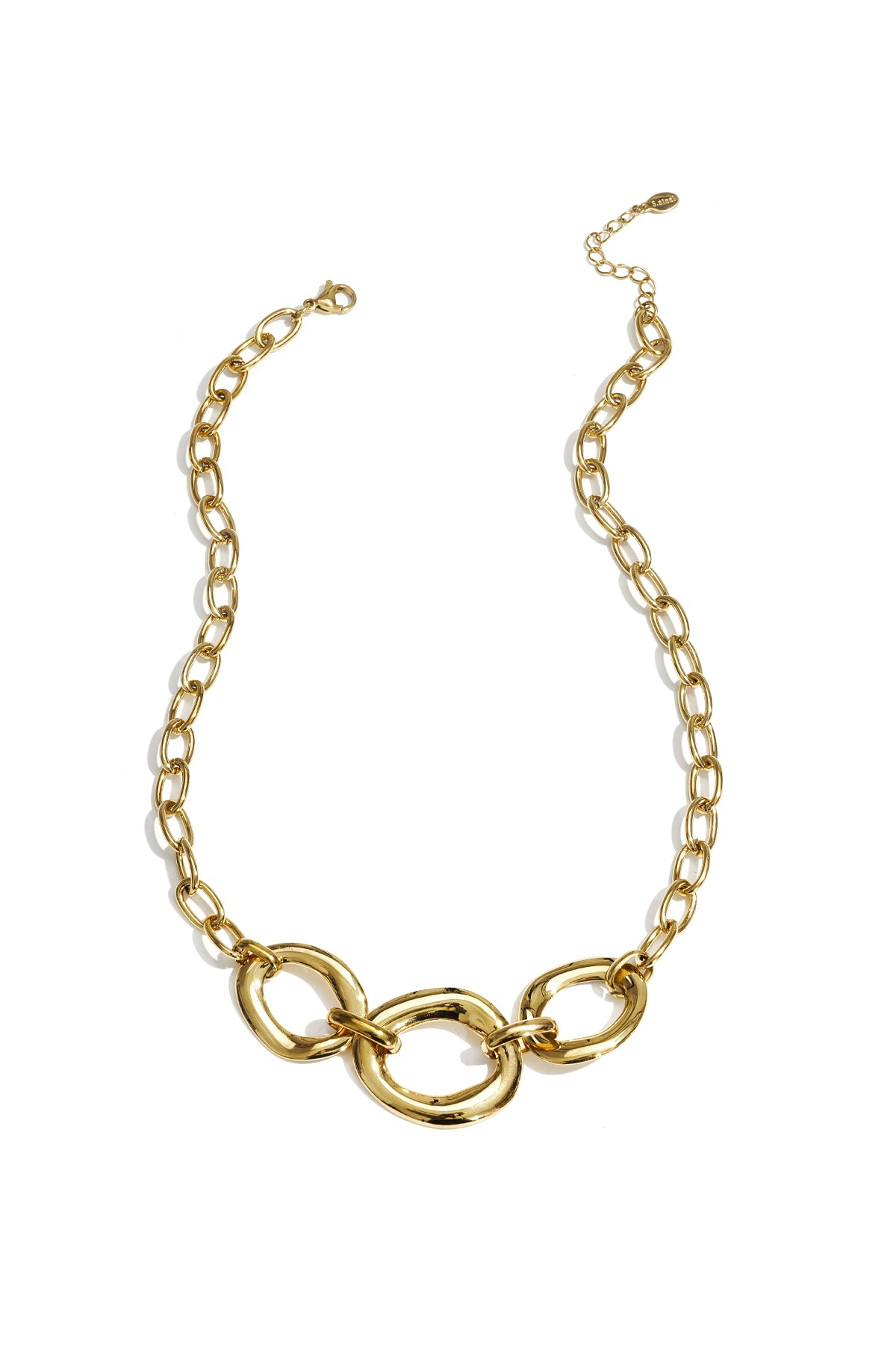 Gold chunky link necklace with three oversized rounded links and adjustable chain laid flat on white background