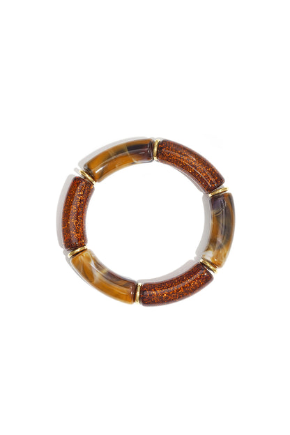 Brown glitter and marbled resin beaded stretch bracelet with gold-tone spacers on white background