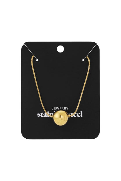 Elegant gold bead necklace featuring a single polished spherical pendant on a delicate chain, displayed on a black card.