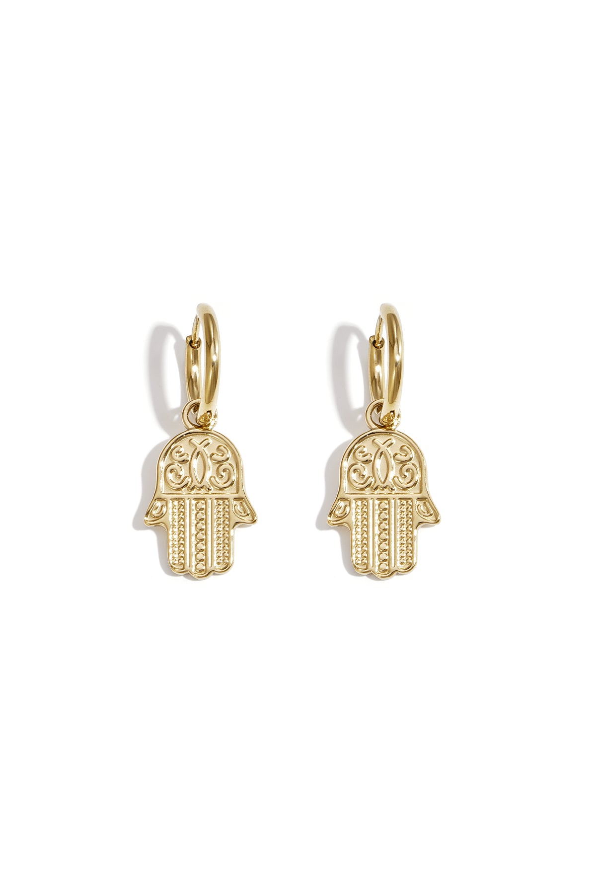 Pair of gold tone Hamsa charm drop earrings on white background