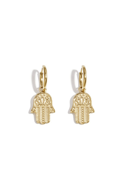 Pair of gold tone Hamsa charm drop earrings on white background