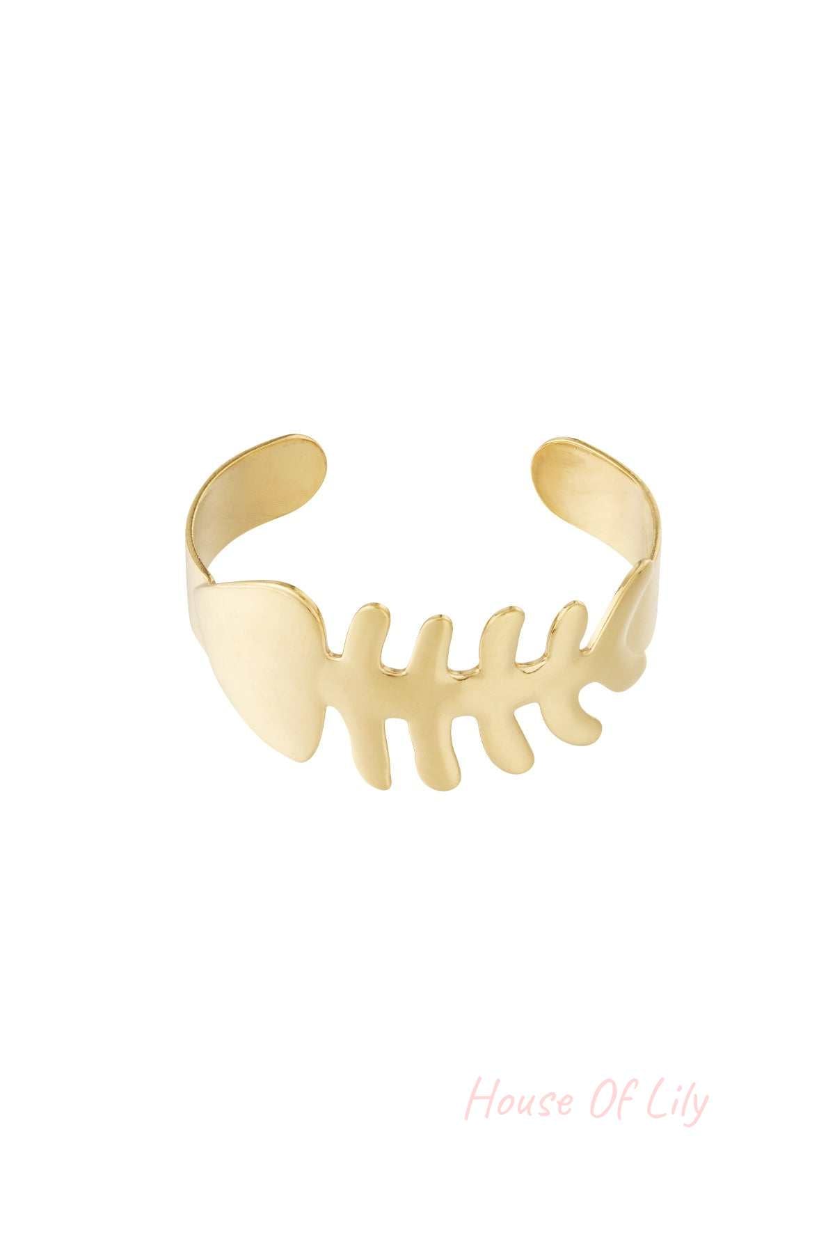 Gold fishbone shaped open cuff bangle bracelet isolated on white background