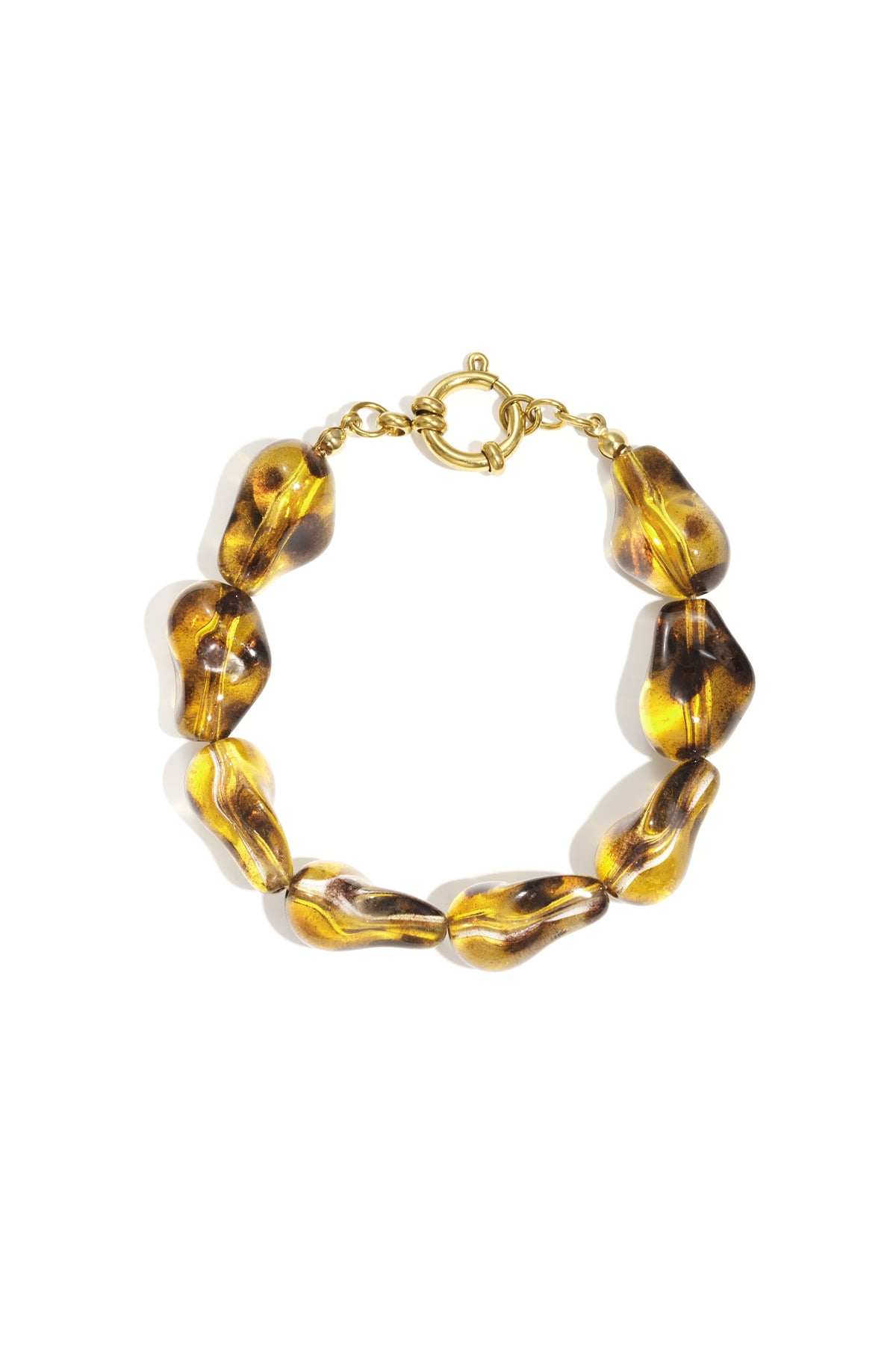 Amber-colored irregular-shaped acrylic bead bracelet with a gold-tone toggle clasp on a white background