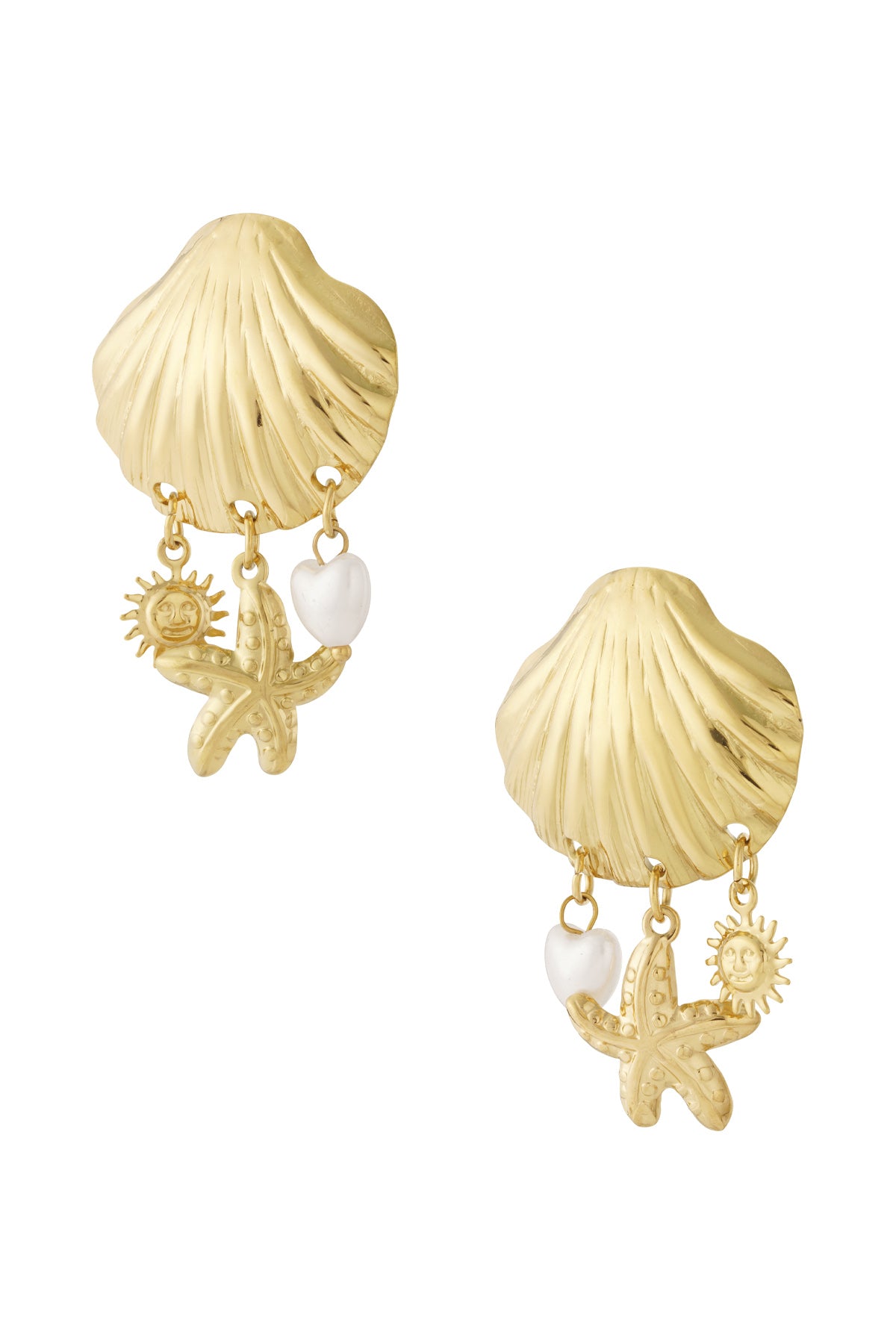 Pair of gold seashell-shaped drop earrings with dangling sun, starfish, and white heart pearl charms on white background