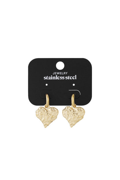 Gold-tone stainless steel hoop earrings featuring brushed, textured heart charms on a black display card.