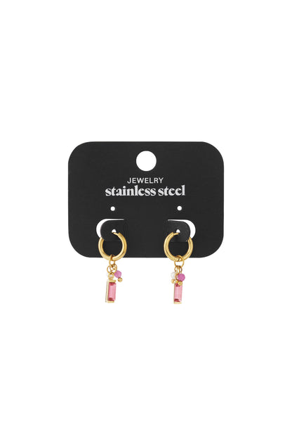 Gold stainless steel hoop earrings with hanging pink rectangular charms on a black display card.