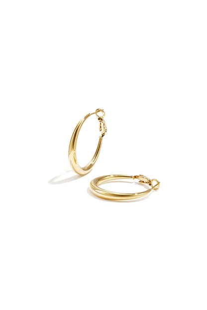 Classic Everyday Hoops: Minimalist gold-tone metal hoop earrings with a smooth, polished finish.