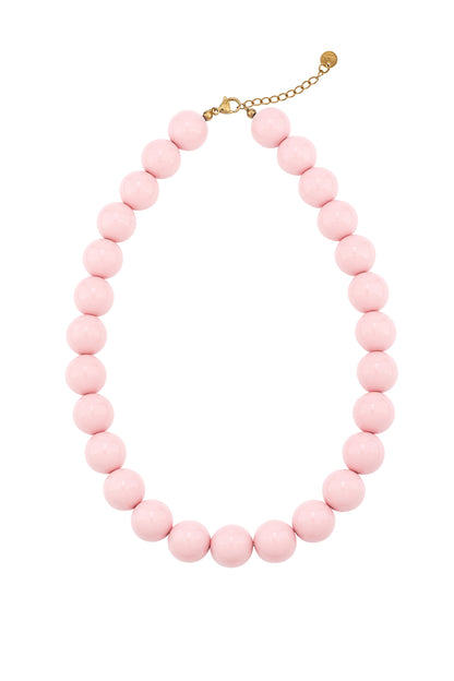 Red chunky resin beaded necklace with gold chain clasp photographed on white background