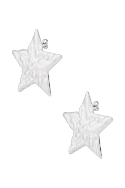 Pair of silver hammered star-shaped stud earrings shown on white background