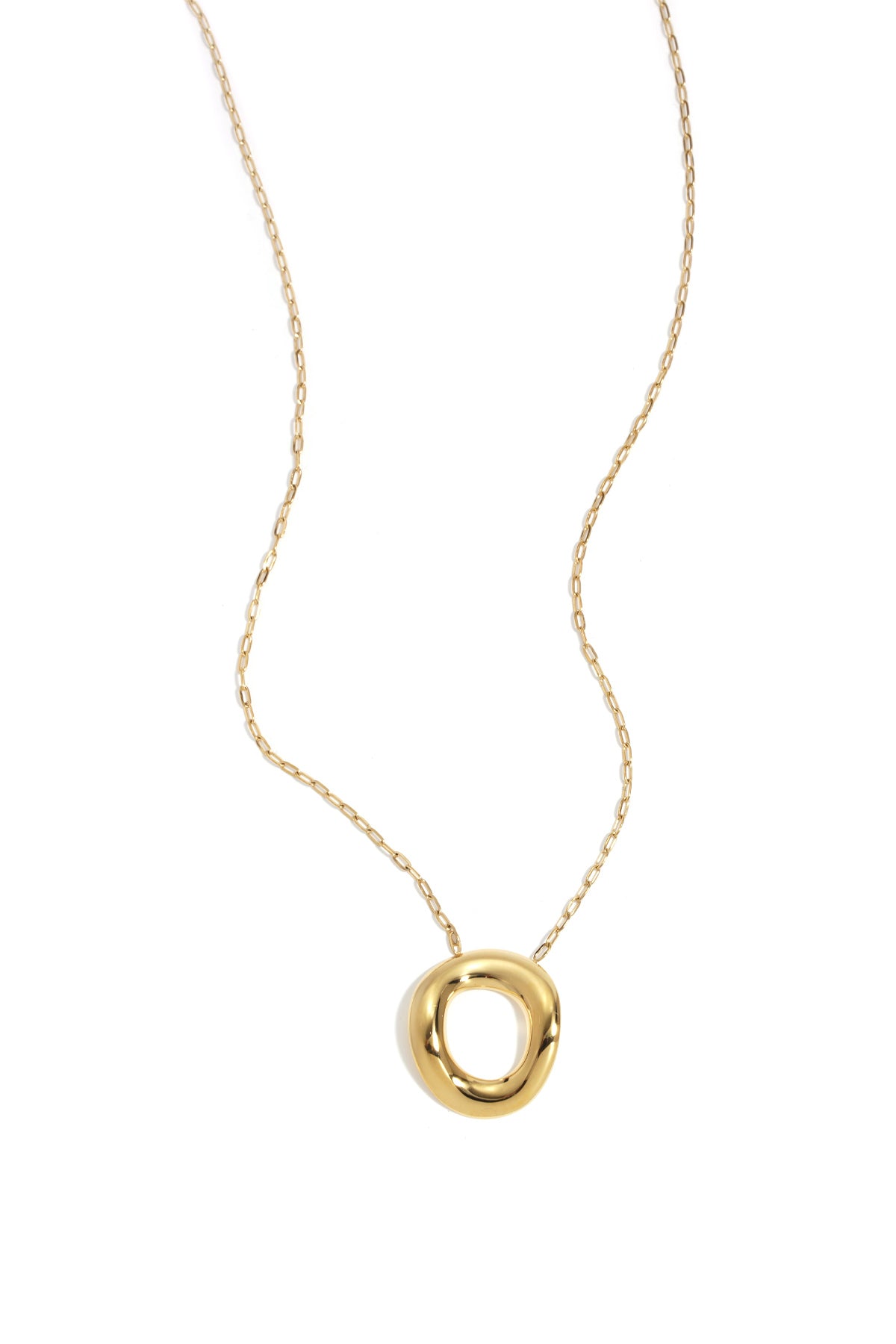 Gold necklace with a chunky, irregular circular pendant on a delicate chain against a white background