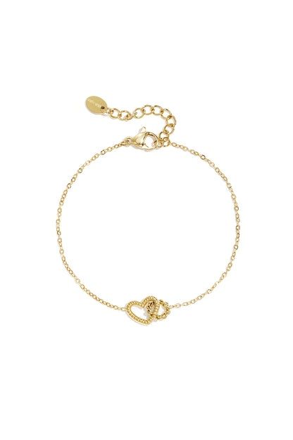 Close-up of delicate gold chain bracelet with textured heart charm and lobster clasp on white background
