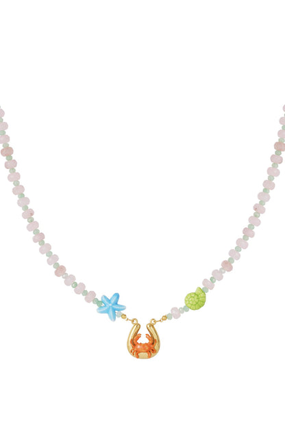 Beaded necklace with pastel pink stones, blue starfish, green shell, and a gold horseshoe charm featuring an orange crab.