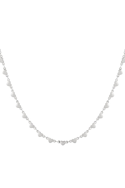 Close-up of a delicate silver multi heart necklace with small heart-shaped links on a white background