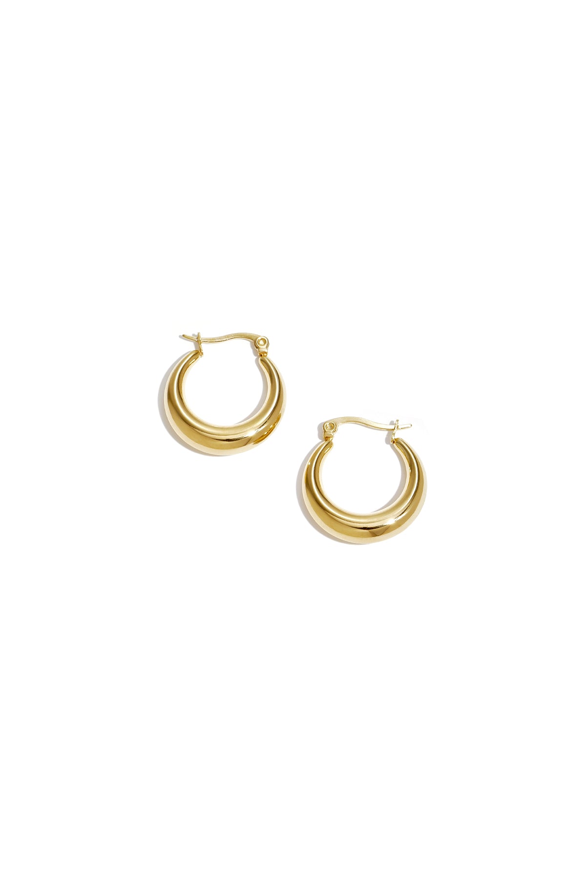 Pair of shiny chunky gold hoop earrings with a smooth polished finish displayed on a white background
