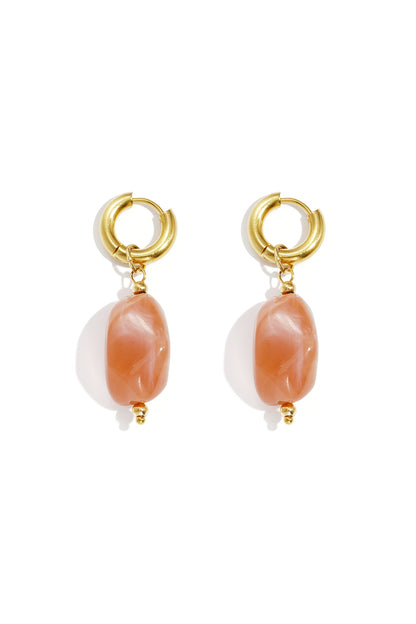 Dreamy Jelly Pebble Drops: Gold hoop earrings featuring translucent, peach-colored organic pebble charms.